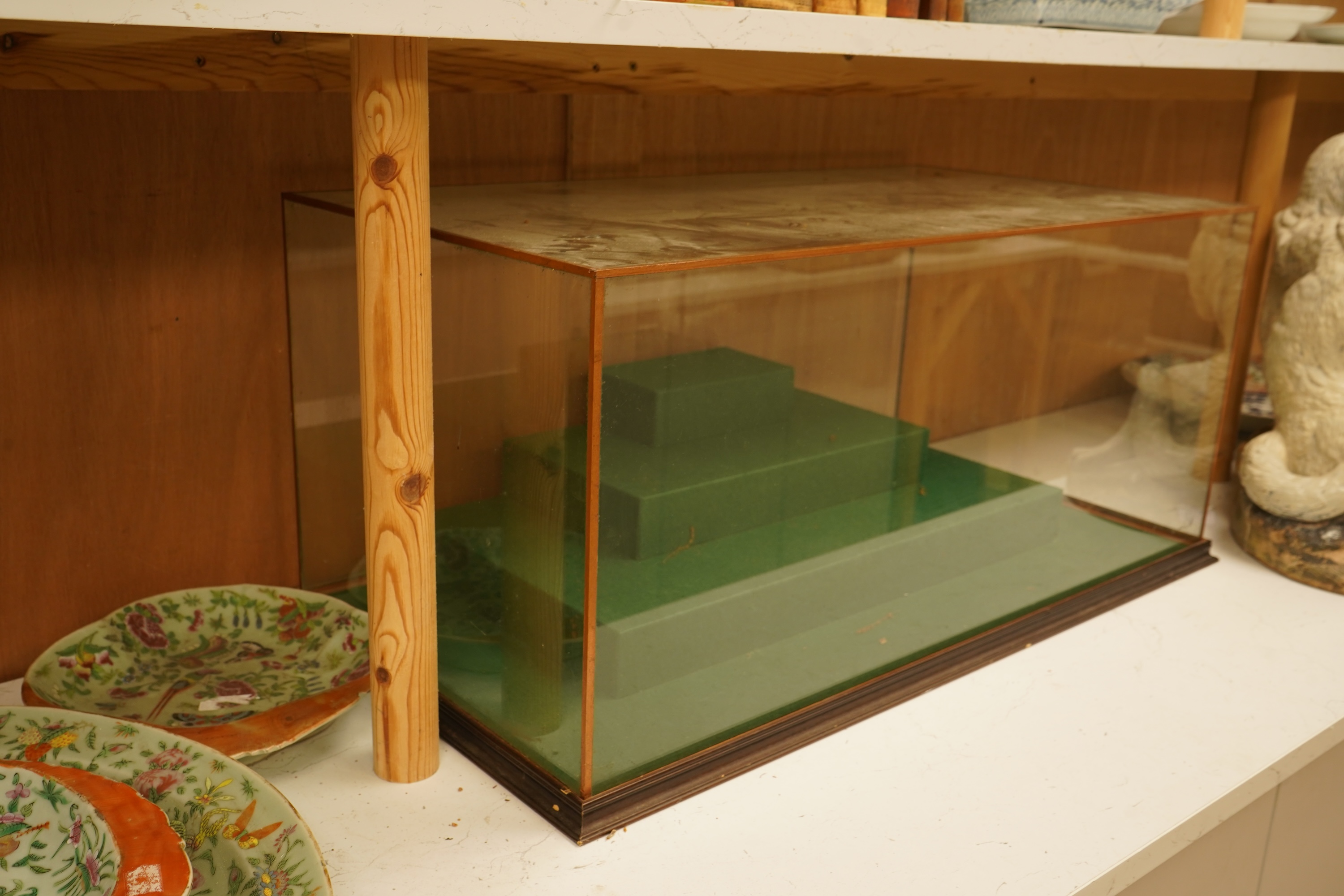 A large table top glass display cabinet with a stepped interior green baize base, 73.5cm wide x 33cm high x 39cm deep
